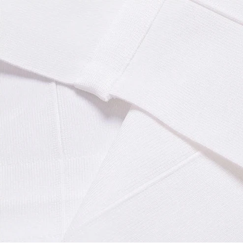 White garment with a size label on a gray background